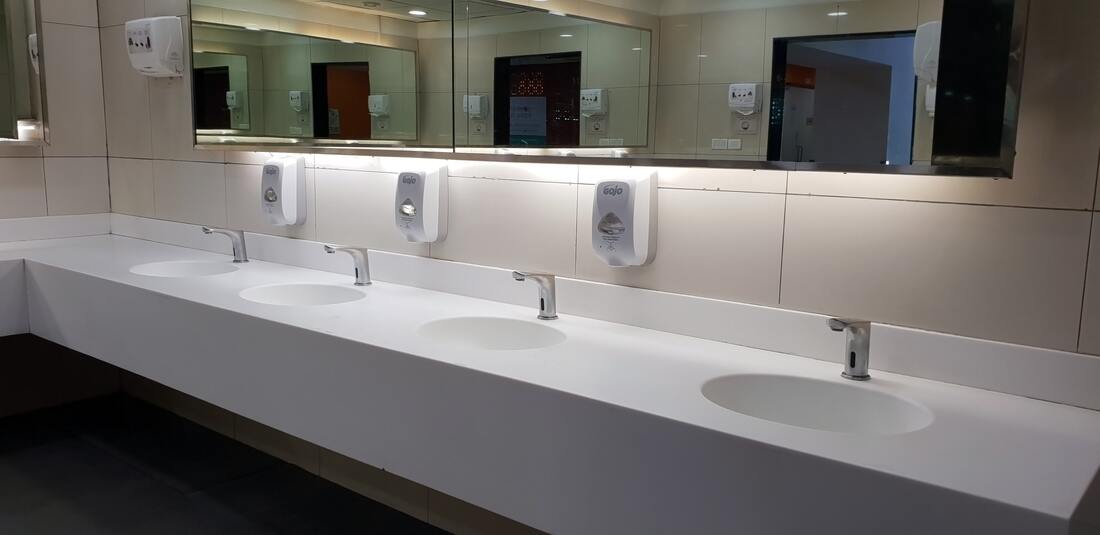 Row of sinks in a workplace, how to encourage water saving in the workplace